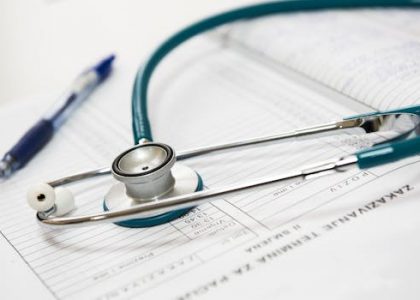 medical-appointment-doctor-healthcare-40568-40568 A stethoscope and pen resting on a medical report in a healthcare setting.